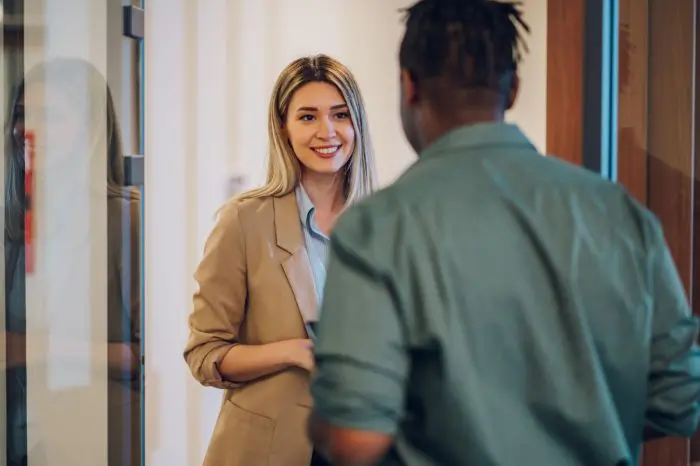two multiracial business colleagues working together