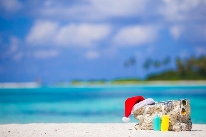beach accessories with santa hat on white tropical