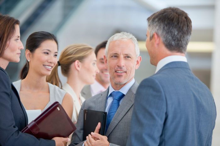 happy business employees talking to each other