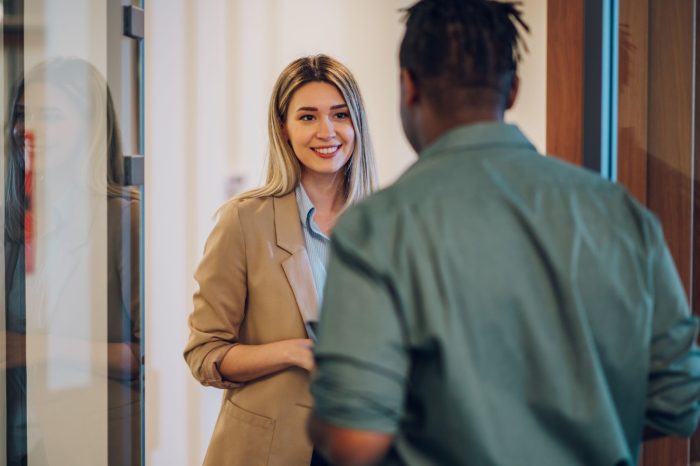 two multiracial business colleagues working together
